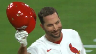 Adam Wainwright holding his helmet