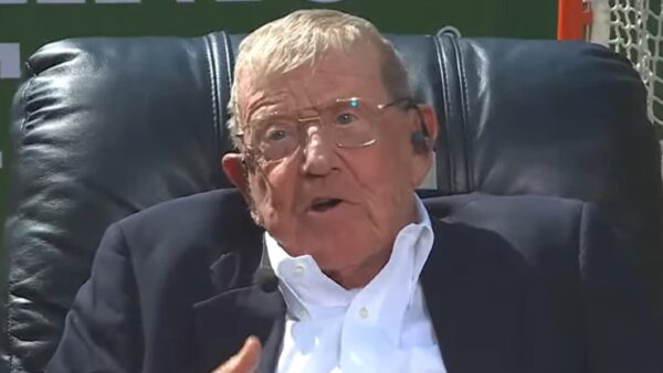 Lou Holtz with a headset on