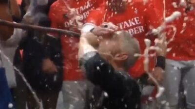 Mike Elias drinking from the 'Dong Bong'