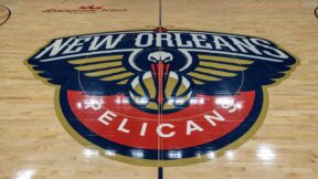 The New Orleans Pelicans logo at center court