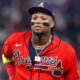 Ronald Acuna Jr in a red Braves uniform