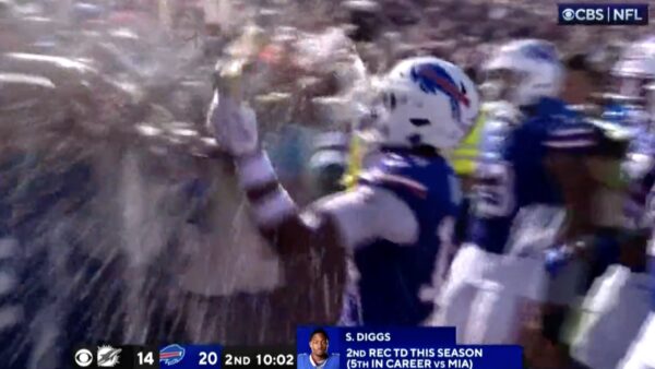 Stefon Diggs celebrating with beers like Stone Cold during a Bills-Dolphins game