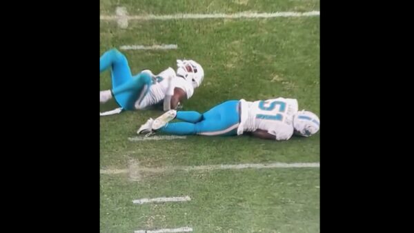 Two Dolphins players down on the ground