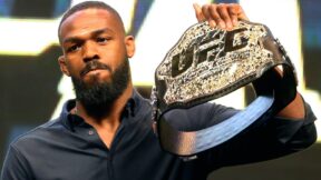 Jon Jones holds up a UFC belt