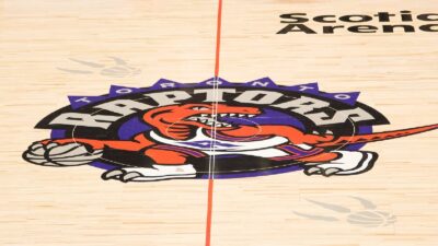 The Toronto Raptors logo at midcourt