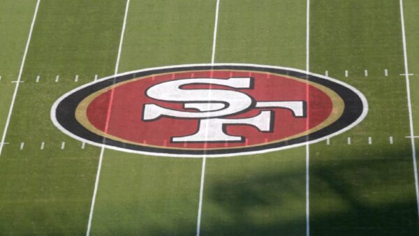 The San Francisco 49ers logo at midfield