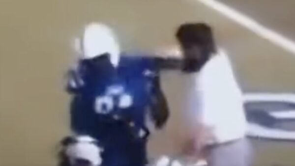 A high school coach punches a player