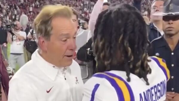 Nick Saban chats with a former player