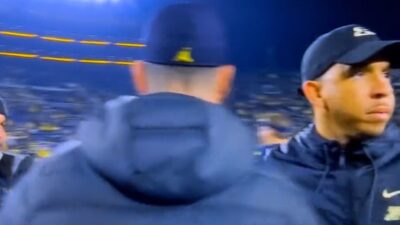 Jim Harbaugh with Ryan Walters