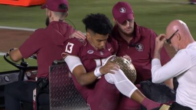 Jordan Travis on a cart