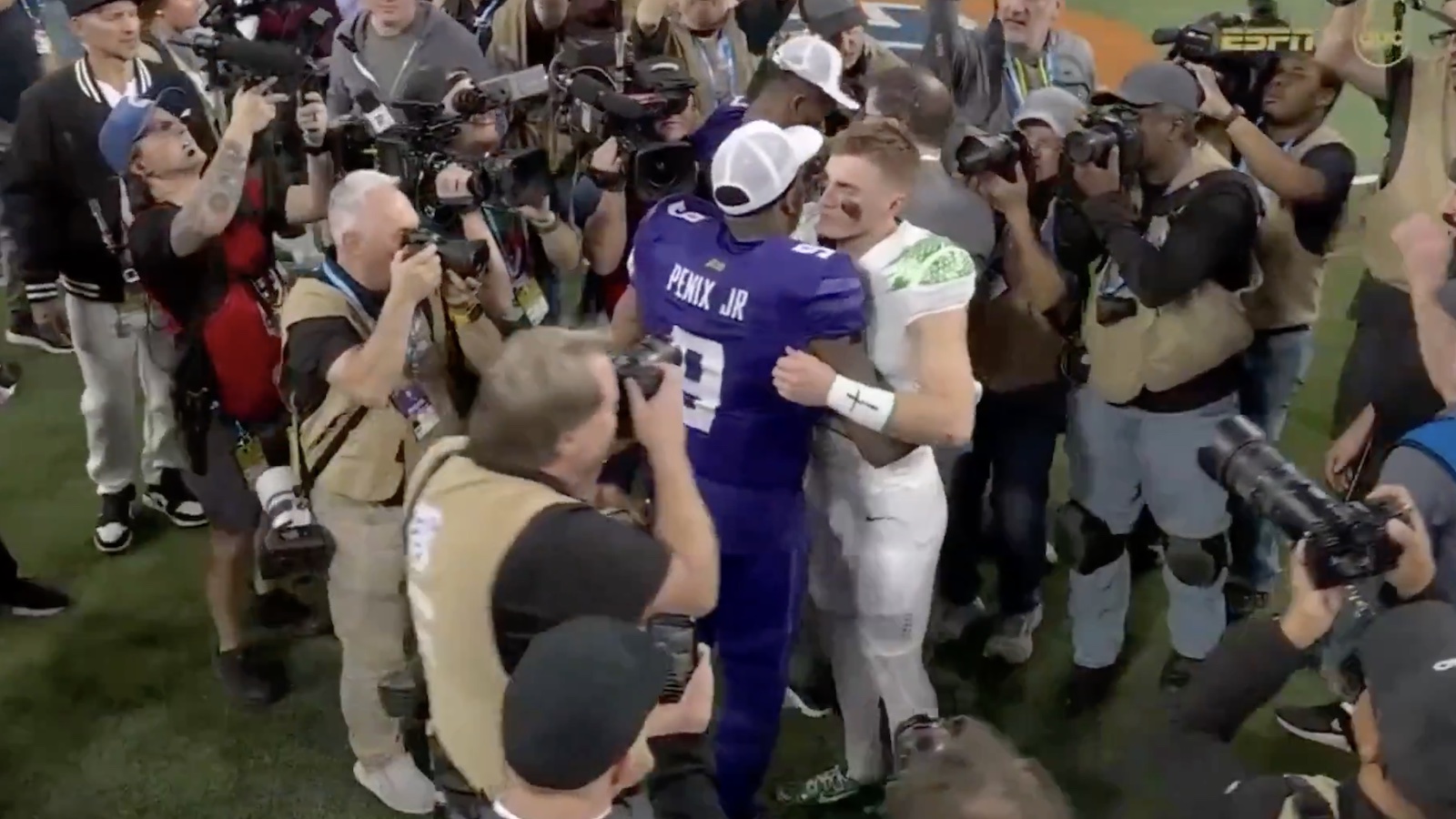 Bo Nix and Michael Penix Jr. hugging after Washington-Oregon game