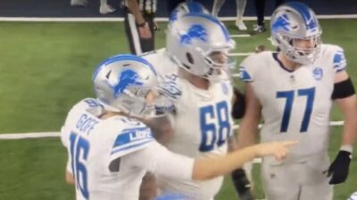 Jared Goff points in the huddle