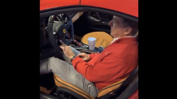 Alabama head coach Nick Saban riding his Ferrari