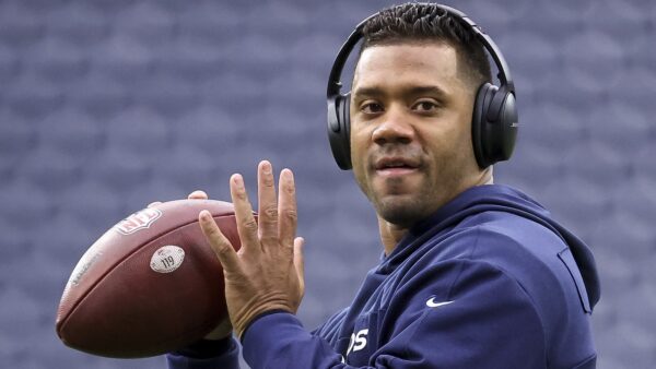 Russell Wilson throws during warmups
