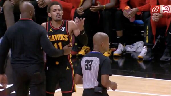 Hawks guard Trae Young arguing with a referee