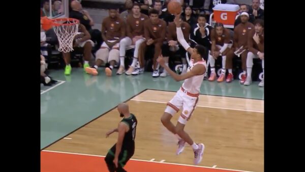 Victor Wembanyama rising up for a dunk during a Celtics-Spurs game