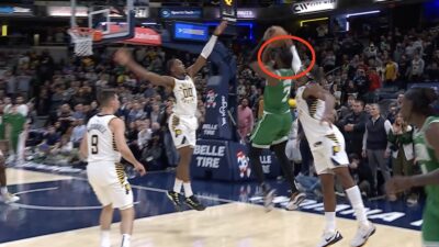 Buddy Hield contesting Jaylen Brown during a Celtics-Pacers game