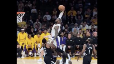 LeBron James dunking over Paul George during Lakers-Clippers game