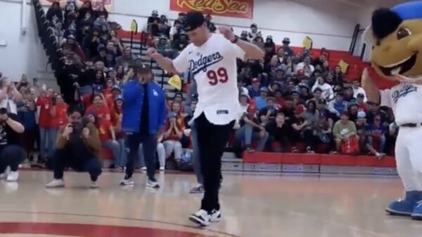 Joe Kelly dances at a high school