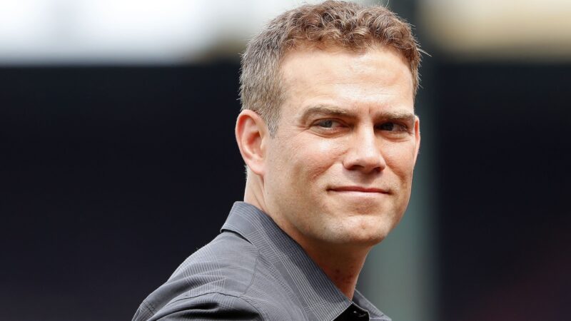Theo Epstein looks on