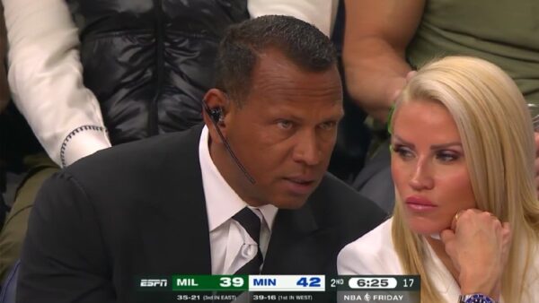 Alex Rodriguez sitting courtside with a tan