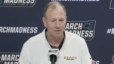 Dan Monson at a press conference