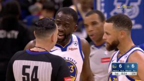 Draymond Green arguing with a referee while Steph Curry looks on