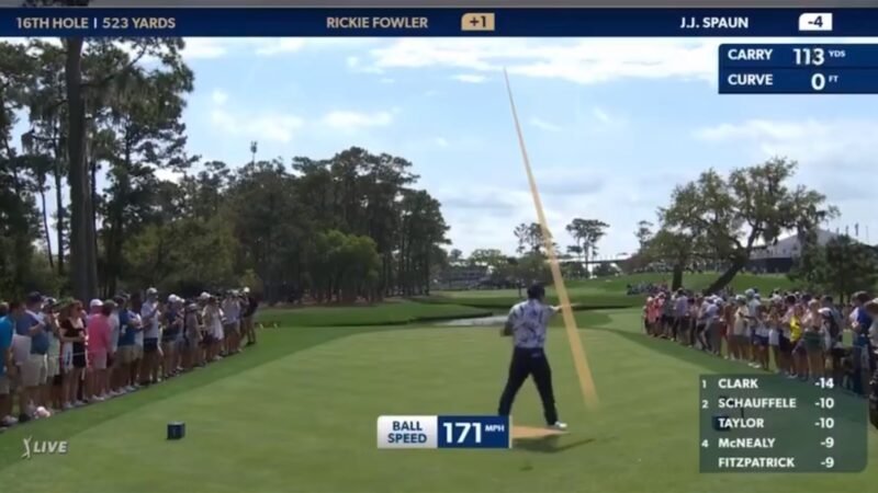 Rickie Fowler pointing at a fan
