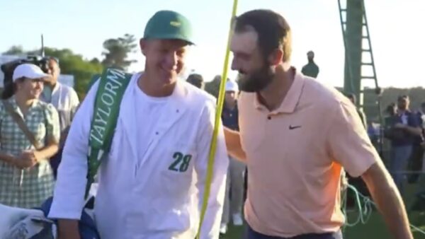 Scottie Scheffler walks with caddie Ted Scott