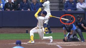 Brewers outfielder Jake Bauer hitting Rays catcher Rene Pinto on the helmet with his bat