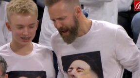 Fans wearing crying Devin Booker shirts