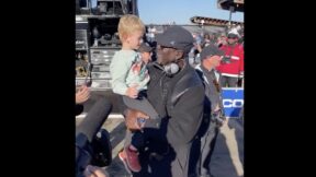 Michael Jordan celebrating with Tyler Reddick's son Beau at the Talladega 500
