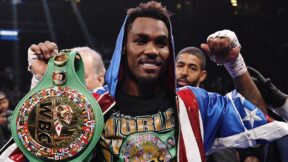 Jermall Charlo holds up his WBC title belt