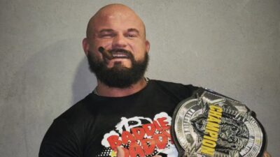 John Klinger poses with a title belt