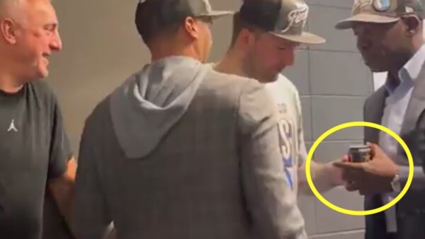 Luka Doncic has a beer taken away from him