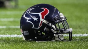 A Houston Texans helmet on the grass