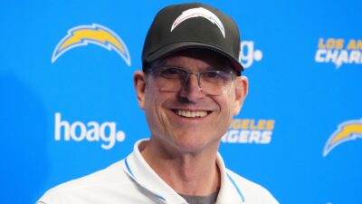 Jim Harbaugh in a Chargers hat