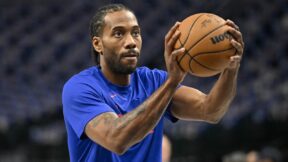 Kawhi Leonard holds a ball