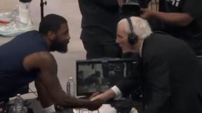 Kyrie Irving shaking hands with Hubie Brown