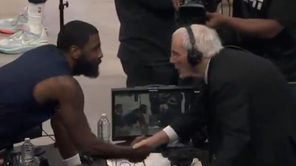 Kyrie Irving shaking hands with Hubie Brown