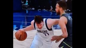 Luka Doncic dribbling past Kyle Anderson