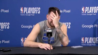 Mavericks star Luka Doncic laughing during a press conference