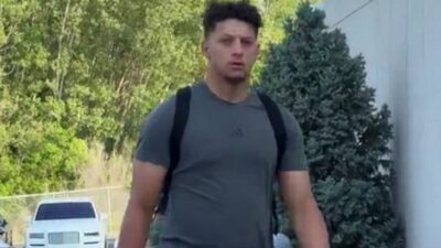 Patrick Mahomes walking with a backpack