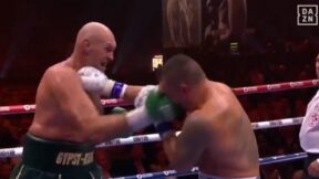 Tyson Fury punches Oleksandr Usyk