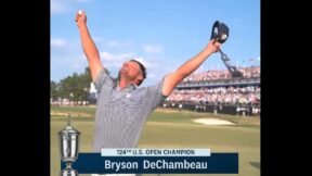 Bryson DeChambeau raises his arms