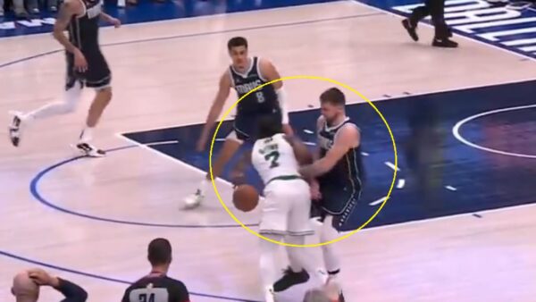 Luka Doncic fouling Jaylen Brown