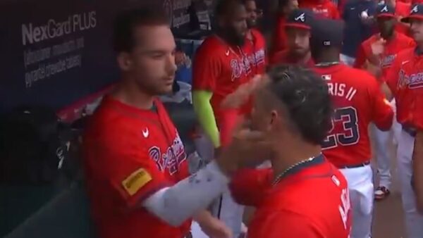 Matt Olson slapping Orlando Arcia as part of a handshake