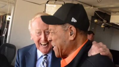 Vin Scully next to Willie Mays