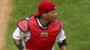 Yadier Molina wearing a Cardinals cap