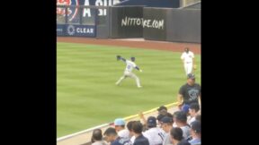 Dodgers pitcher Yoshinobu Yamamoto doing a pregame long toss